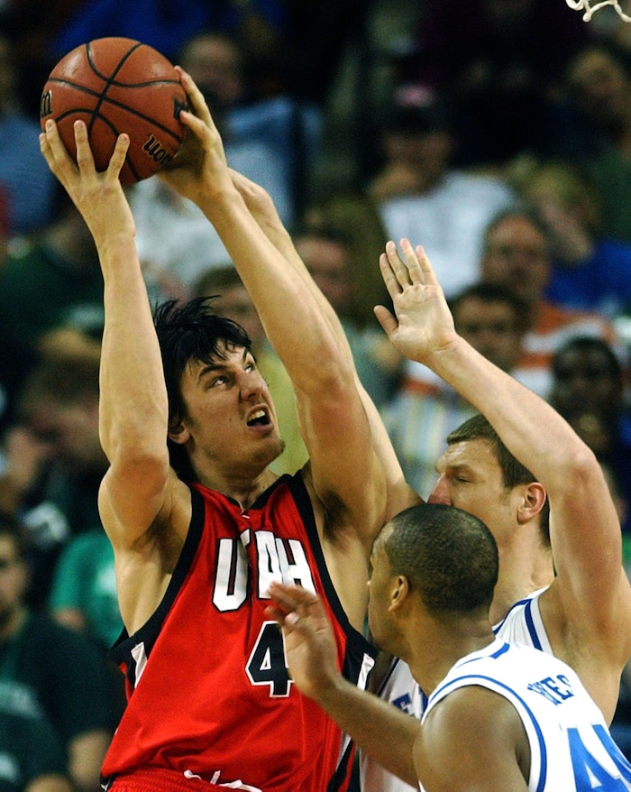 Andrew Bogut goes to the hoop for the Utes as Chuck Hayes and  Lukasz Oberzut,  defend in third round NCAA action, Utah vs Kentucky,  at the  Ewers Center in Austin.  photo by Rick Egan