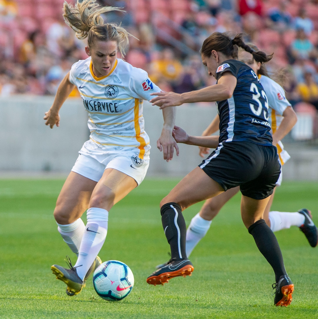 (Rick Egan  |  The Salt Lake Tribune)   Seattle Reign FC defender Theresa Nielsen (8) goes for the ball along with Seattle Reign FC defender Steph Cox, in soccer action between Utah Royals FC and Seattle Reign FC in Sandy, Friday, June 28, 2019.