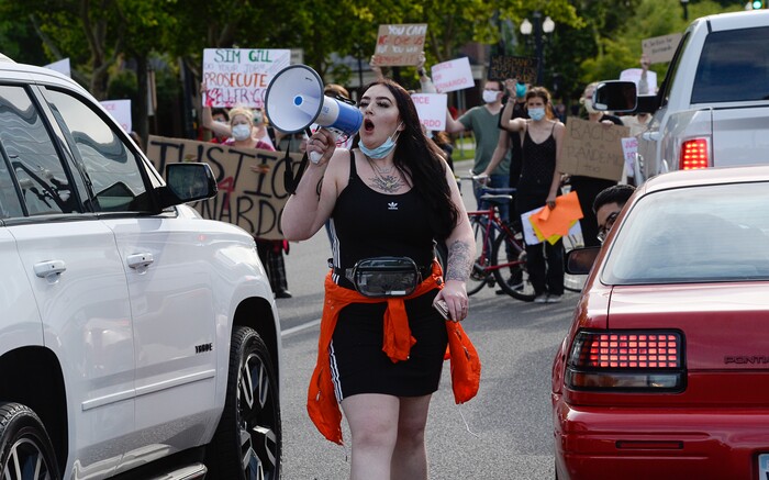 (Francisco Kjolseth  |  The Salt Lake Tribune) Sofia Alcala leads the crowd as they chant during a Rally for Bernardo Palacios, in front of the Salt Lake County District Attorney's office and block traffic along 500 S. on Thursday, June 18, 2020.