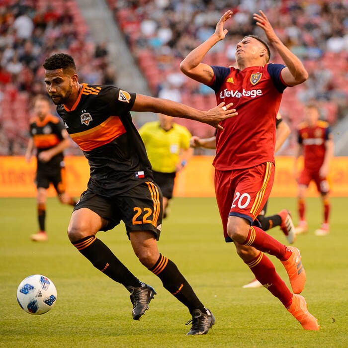 (Trent Nelson | The Salt Lake Tribune)  
Real Salt Lake midfielder Luis Silva (20) takes a hand to the face from Houston Dynamo defender Leonardo (22) as Real Salt Lake hosts Houston Dynamo, MLS Soccer at Rio Tinto Stadium in Sandy, Utah, Wednesday May 30, 2018.
