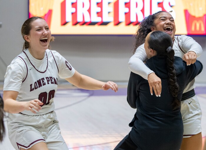 (Rick Egan | The Salt Lake Tribune) Katy Lawrence (00) and Makeili Ika (4) celebrate Lone Peak's win over the Skyridge Falcons, in the 6A girls Championship Game between Skyridge and Lone Peak, at Weber State, on Saturday, March 4, 2023.
