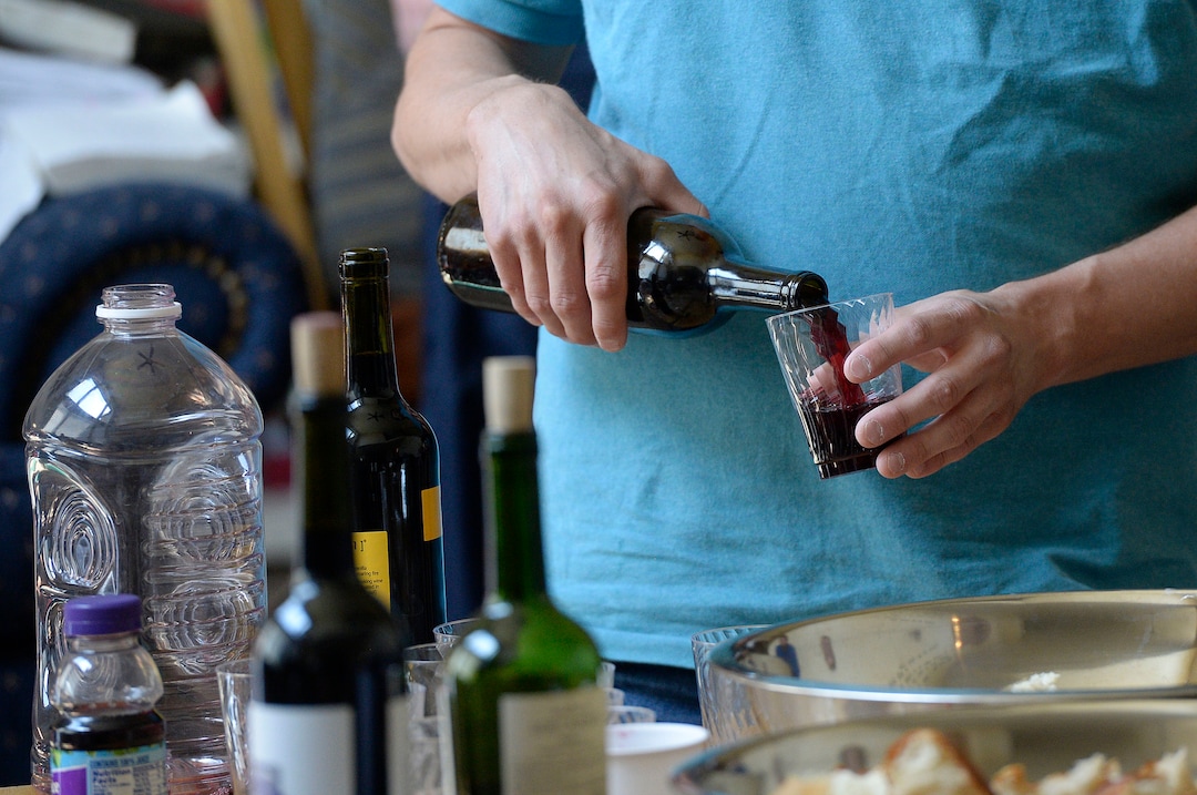 (Al Hartmann  |  The Salt Lake Tribune)
Believers in Denver Snuffer's Remnant movement gather in a Sandy home for a fellowship meeting Sunday, Aug. 13, to sing songs and partake of the sacrament. Wine is served as sacrament after being blessed.