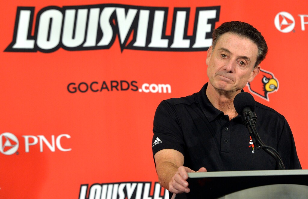 FILE - In this Oct. 3, 2015, file photo, Louisville head coach Rick Pitino responds to a question following an NCAA college basketball team's intrasquad scrimmage in Louisville, Ky. Louisville's Athletic Association has officially fired coach Rick Pitino, Monday, Oct. 16, 2017,  nearly three weeks after the school acknowledged that its men's basketball program is being investigated as part of a federal corruption probe.(AP Photo/Timothy D. Easley, File)