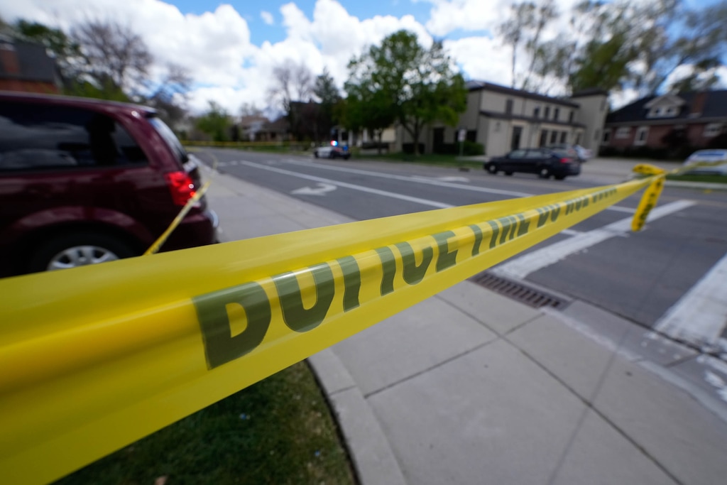 (Francisco Kjolseth | The Salt Lake Tribune) Crime scene investigators work the scene of an auto-pedestrian fatal accident near the intersection of 900 E. 1700 South in Salt Lake City on Tuesday, May 3, 2022. A woman and child who were walking on the sidewalk were struck when a car drove over the curb and hit them. The driver of the car, Jack Archibald, was sentenced to prison Monday.