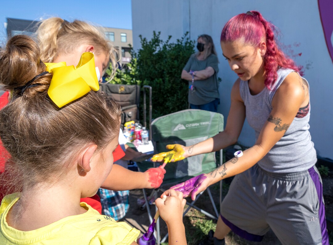 (Rick Egan | The Salt Lake Tribune) Max Thayne 8, and Skyler Siegel, 6 paint Tesha Taylor's hands, so she can put her hand prints on the wall, during a memorial for Tesha's brother, Dillon Taylor, on Wednesday, Aug. 11, 2021.