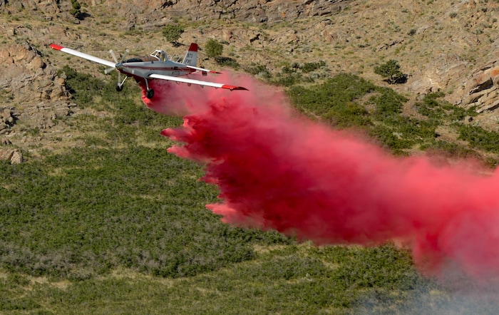 (Francisco Kjolseth  |  The Salt Lake Tribune) Fire crews battle a fire near Millcreek Canyon, on Saturday, July 11, 2020, started near 3400 South Crestwood Dr., as helicopters, single engine air tankers and multiple crews respond.