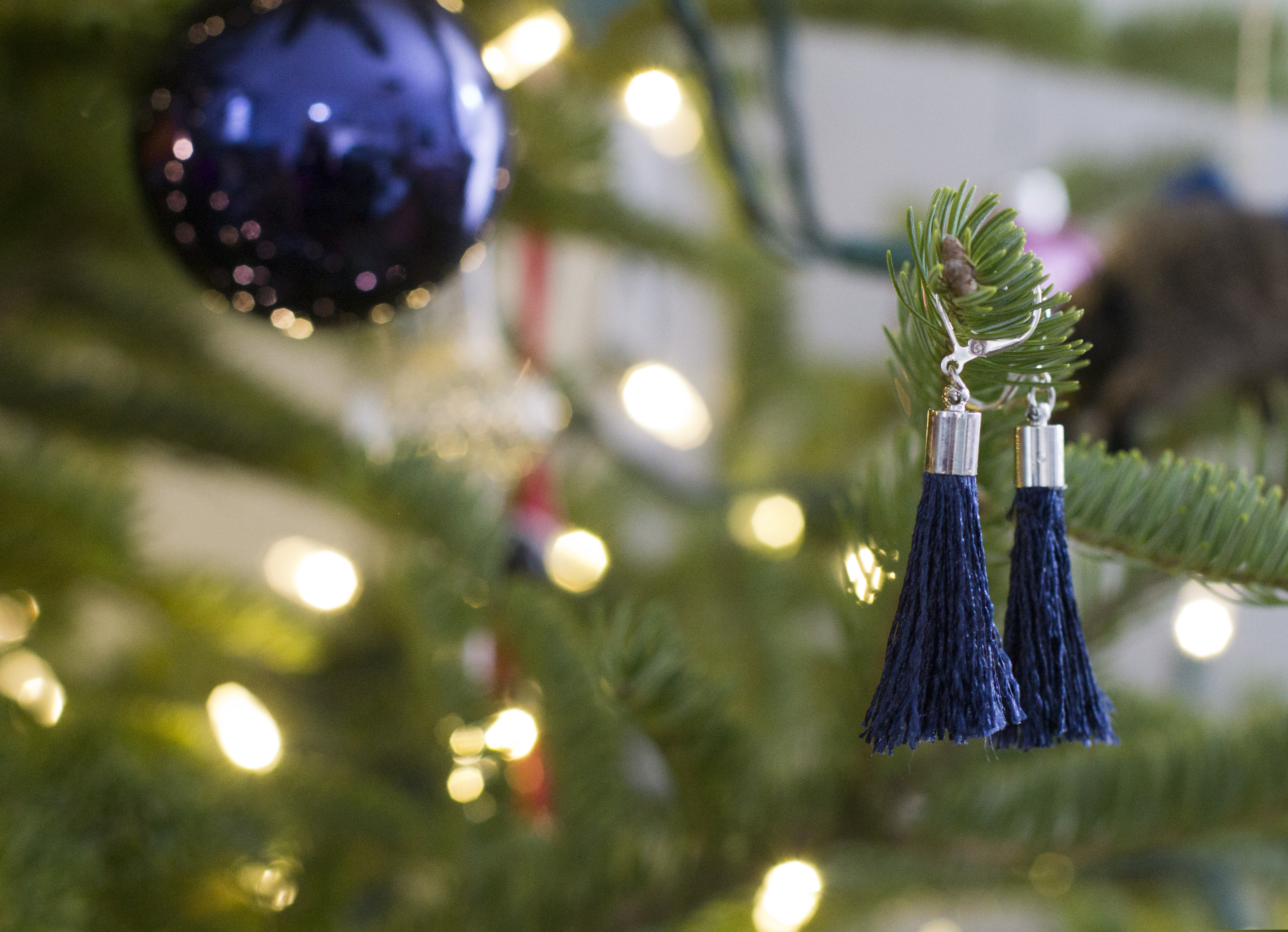 (AP Photo/Holly Ramer) This Dec. 17, 2018, photo shows handmade earrings hanging on a Christmas tree in Hopkinton, N.H.