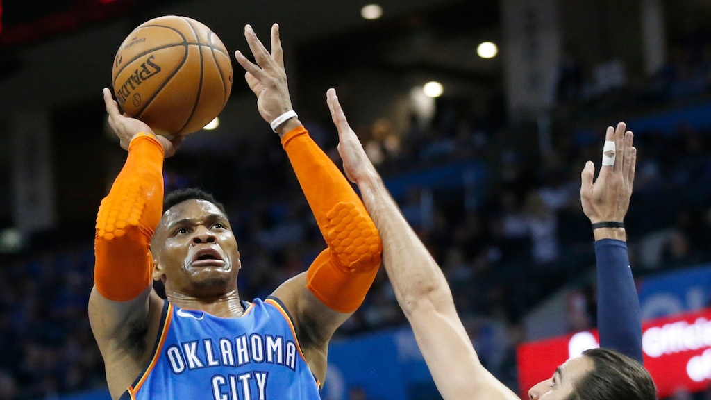 Oklahoma City Thunder's Russell Westbrook (0) shoots as Utah Jazz guard Ricky Rubio (3) defends in the first half of an NBA basketball game in Oklahoma City, Friday, Feb. 22, 2019. (AP Photo/Sue Ogrocki)