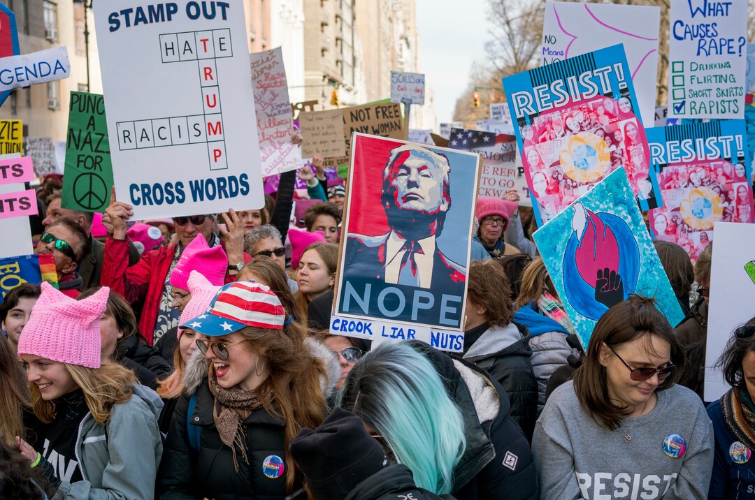 People take part in a rally portion of a march highlighting equal rights and equality for women Saturday, Jan. 20, 2018, in New York.  The New York protest was among more than 200 such actions planned for the weekend around the world.  (AP Photo/Craig Ruttle)