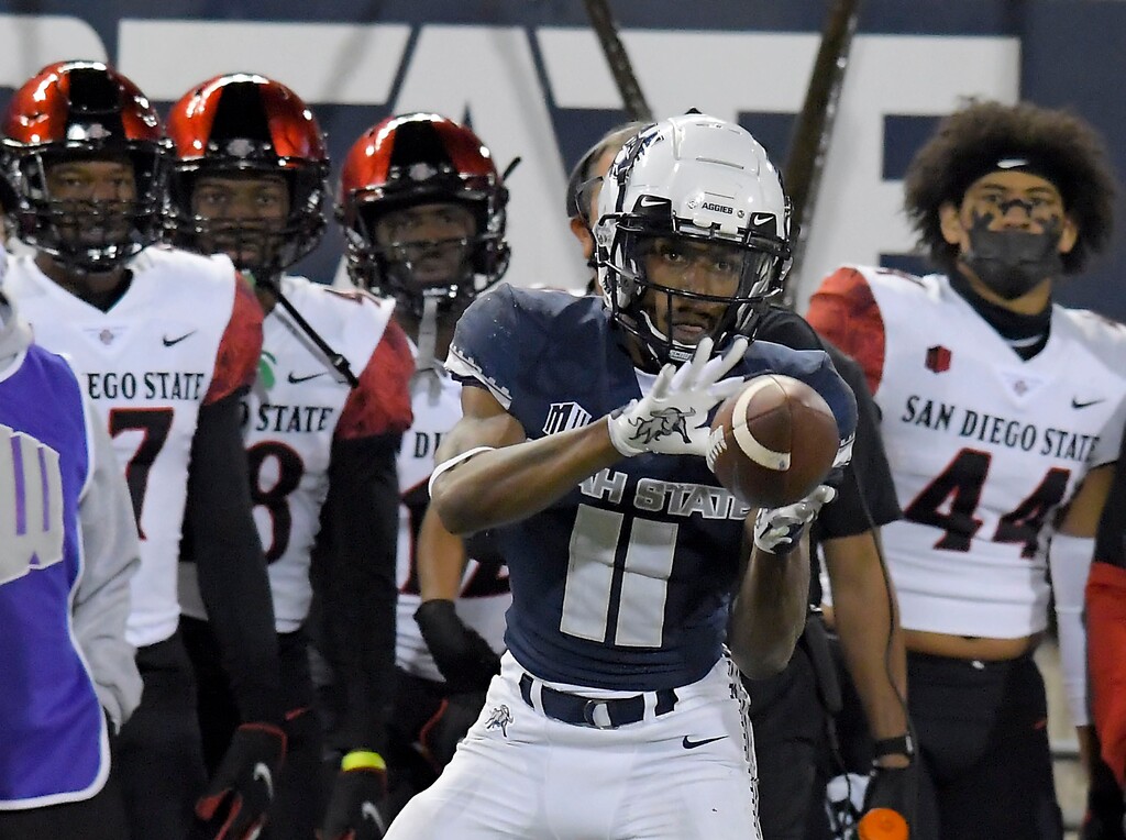Utah State wide receiver Savon Scarver (11) catches a pass during the first half of the team's NCAA college football game against San Diego State, Saturday, Oct. 31, 2020, in Logan, Utah. (Eli Lucero/The Herald Journal via AP, Pool)
