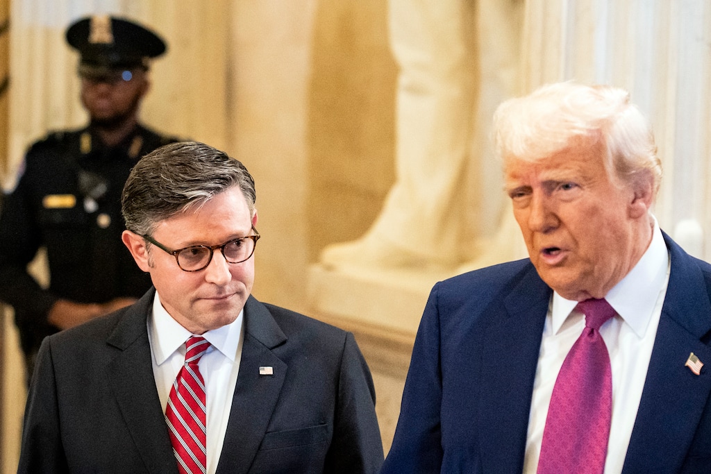 (Haiyun Jiang | The New York Times) House Speaker Mike Johnson, R-La., left, looks on as President Donald Trump speaks to reporters upon his arrival at the Capitol on Tuesday morning, May 20, 2025. Trump is expected to join House Republicans at their weekly meeting at the Capitol as Johnson tries to shore up support for the GOP megabill to deliver the president's agenda.