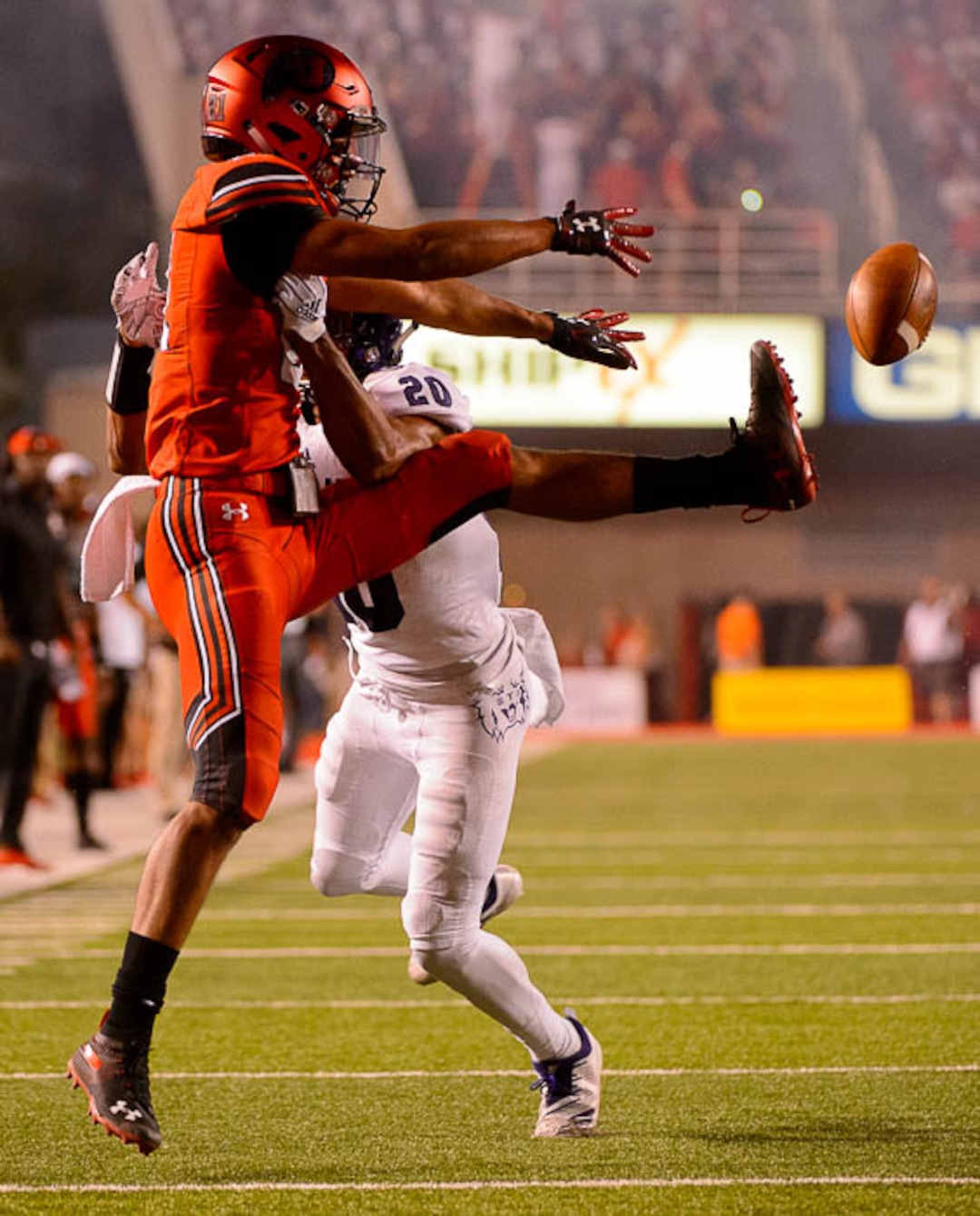 (Trent Nelson | The Salt Lake Tribune)  Utah Utes wide receiver Solomon Enis (21) defended by Weber State Wildcats cornerback Parker Preator (20) as the University of Utah Utes host the Weber State Wildcats, Thursday Aug. 30, 2018 at Rice-Eccles Stadium in Salt Lake City.