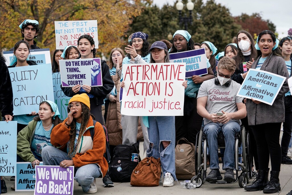 (J. Scott Applewhite | The Associated Press) Activists demonstrate as the Supreme Court hears oral arguments on a pair of cases that could decide the future of affirmative action in college admissions, in Washington, Oct. 31, 2022.