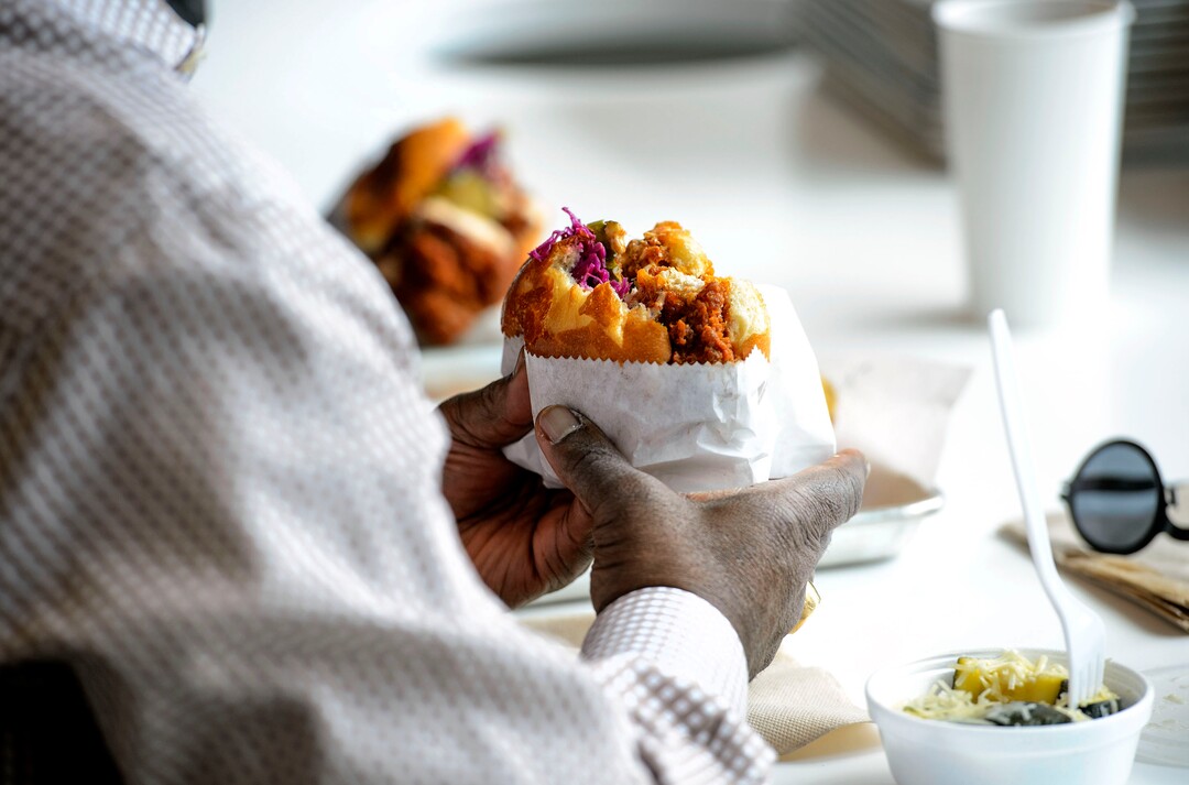 (Steve Griffin  |  The Salt Lake Tribune)  Patrons enjoy the chicken sandwich at Pretty Bird, a new Nashville-style hot chicken restaurant on Regent Street, in Salt Lake City Monday April 23, 2018.