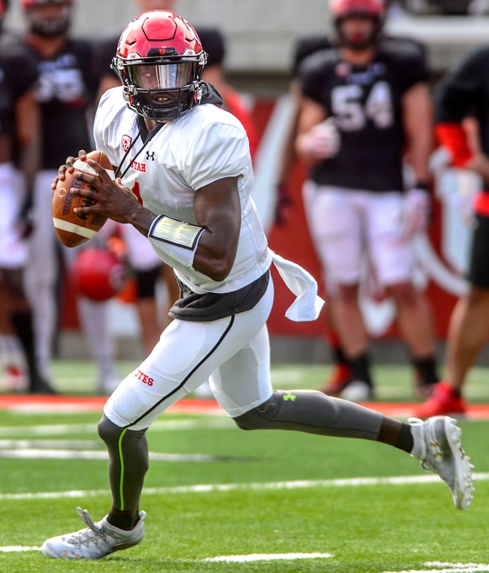(Steve Griffin  |  The Salt Lake Tribune) Utah quarterback Tyler Huntley rolls out of he pocket during the University of Utah football team's first scrimmage at Rice-Eccles Stadium in Salt Lake City Friday March 30, 2018.
