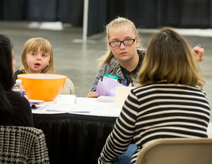 (Rick Egan  |  The Salt Lake Tribune)  Hailey Bartlett and her 3-year-old daughter, Abigail Fletcher, talk to legal help advisers during Project Homeless Connect on Friday, October 6, 2017. The one-day event in Salt Lake City brings together community volunteers to provide services for individuals and families experiencing homelessness.