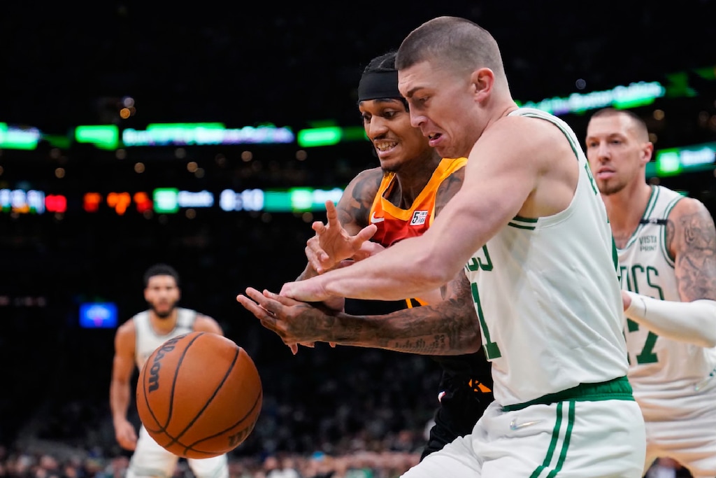 Boston Celtics guard Payton Pritchard, right, steals the ball from Utah Jazz guard Jordan Clarkson during the first half of an NBA basketball game Wednesday, March 23, 2022, in Boston. (AP Photo/Charles Krupa)