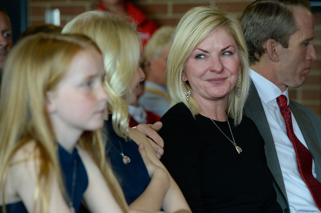 (Francisco Kjolseth  |  The Salt Lake Tribune)  Aly Hill looks over at her daughters as her father, long time University of Utah Athletics Director Chris Hill tells stories during his announced plan to retire this spring after 31years. Joined by his wife Kathy and their kids and grandkids at the Jon M. Huntsman Center on campus on Monday, March 26, 2018, Hill is the longest actively tenured athletics director at the same school in the NCAA FBS.