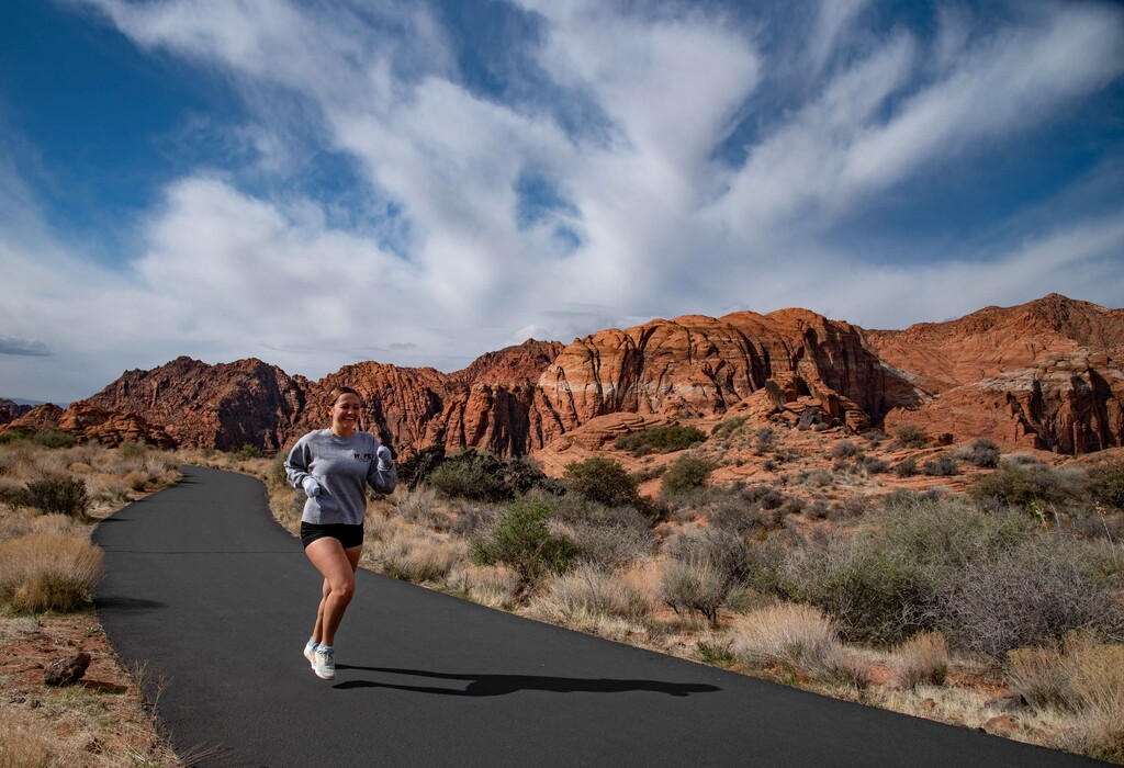 (Francisco Kjolseth | The Salt Lake Tribune) A runner makes her way up the popular Whiptail Trail in Snow Canyon State Park. Popular with cyclists, hikers and runners, the 6-mile roundtrip trail follows the bottom of the park gaining just under 500 feet in elevation.