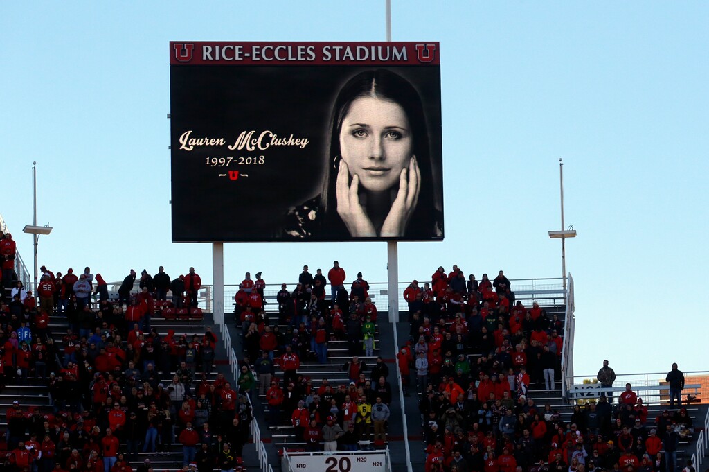 A photograph of University of Utah student and track athlete Lauren McCluskey, who was fatally shot on campus is projected on the video board before the start of an NCAA college football game between Oregon and Utah Saturday Nov. 10, 2018, in Salt Lake City. (AP Photo/Rick Bowmer)