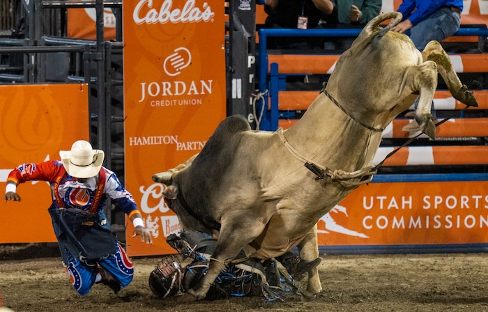 (Rick Egan | The Salt Lake Tribune)  Deklan Garland, from Marlow, Okla., competes in bull Riding at the Utah Days of '47 Rodeo at the State Fairpark, on Monday, July 25, 2022.