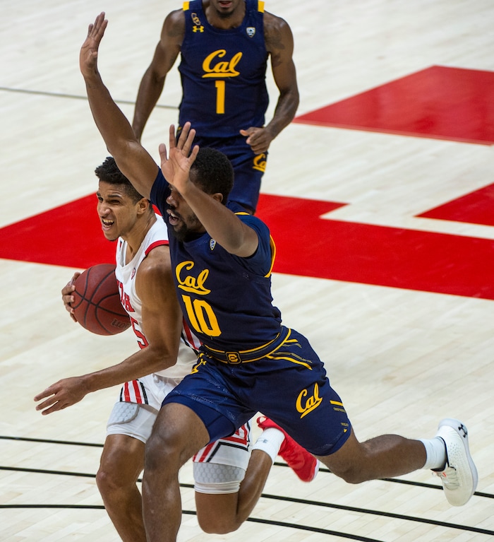 (Rick Egan | The Salt Lake Tribune) California Golden Bears guard Makale Foreman (10) defends as Utah Utes guard Alfonso Plummer (25) scores on a fast break the the end of the first half, in PAC12 Basketball action between the Utah Utes and the California Golden Bears, on Wednesday, Jan. 16, 2021.