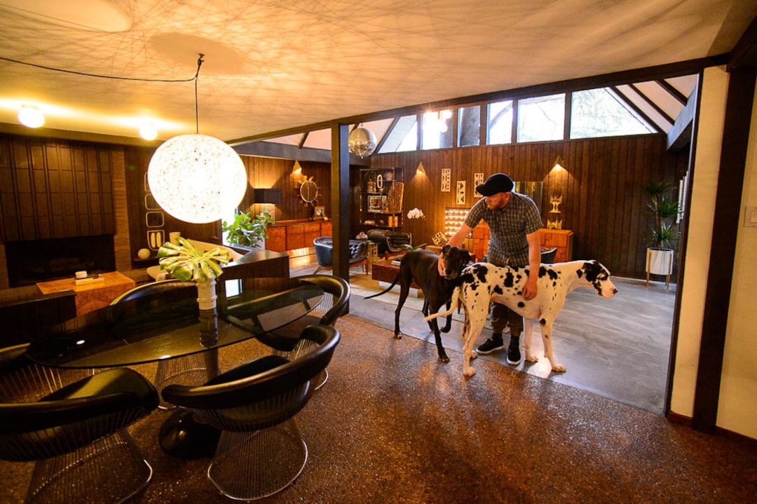 (Trent Nelson | The Salt Lake Tribune)  Scott Pulley with great danes Moose and Agnes in his Westshire neighborhood home in West Valley City which will be featured in an upcoming Modern Home Tour. The homes in this area were built in the 1960s by local architect, Ron Molen, and have unique mid-century modern features. Wednesday Oct. 3, 2018.