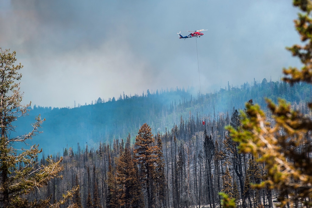(Chris Detrick | The Salt Lake Tribune)
Helicopter crews work to put out the wildfire burning north of the southern Utah ski town of Brian Head in June 2017.