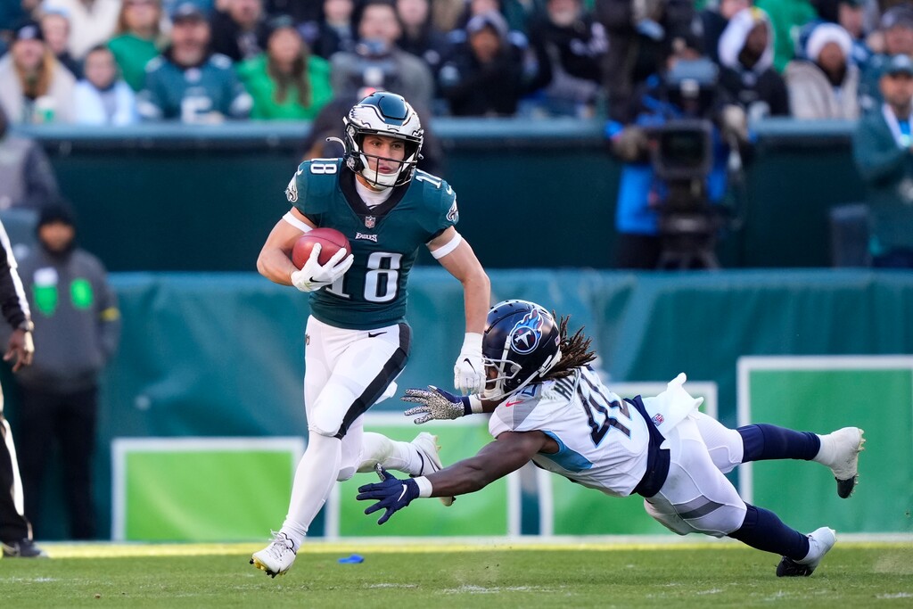 (Matt Rourke | AP) Philadelphia Eagles wide receiver Britain Covey (18) runs past Tennessee Titans running back Dontrell Hilliard during an NFL football game, Sunday, Dec. 4, 2022, in Philadelphia.