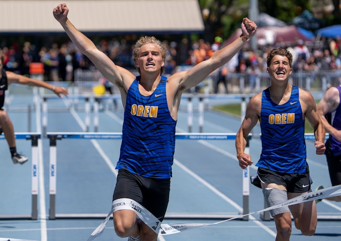 (Rick Egan | The Salt Lake Tribune)   Jackson Egbert and Logan Jensen, finish first and second for Orem High, in the 5A Boys 300 meter dash, at the State High School Championships at BYU, on Saturday, May 21, 2022.
