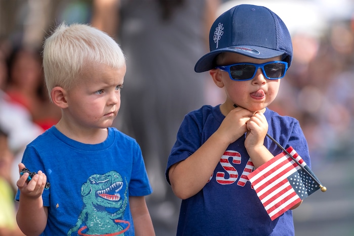 (Rick Egan | The Salt Lake Tribune) Asher Baird and Gideon Mott watch the Days of '47 Parade in Salt Lake City on Thursday, July 24, 2025.