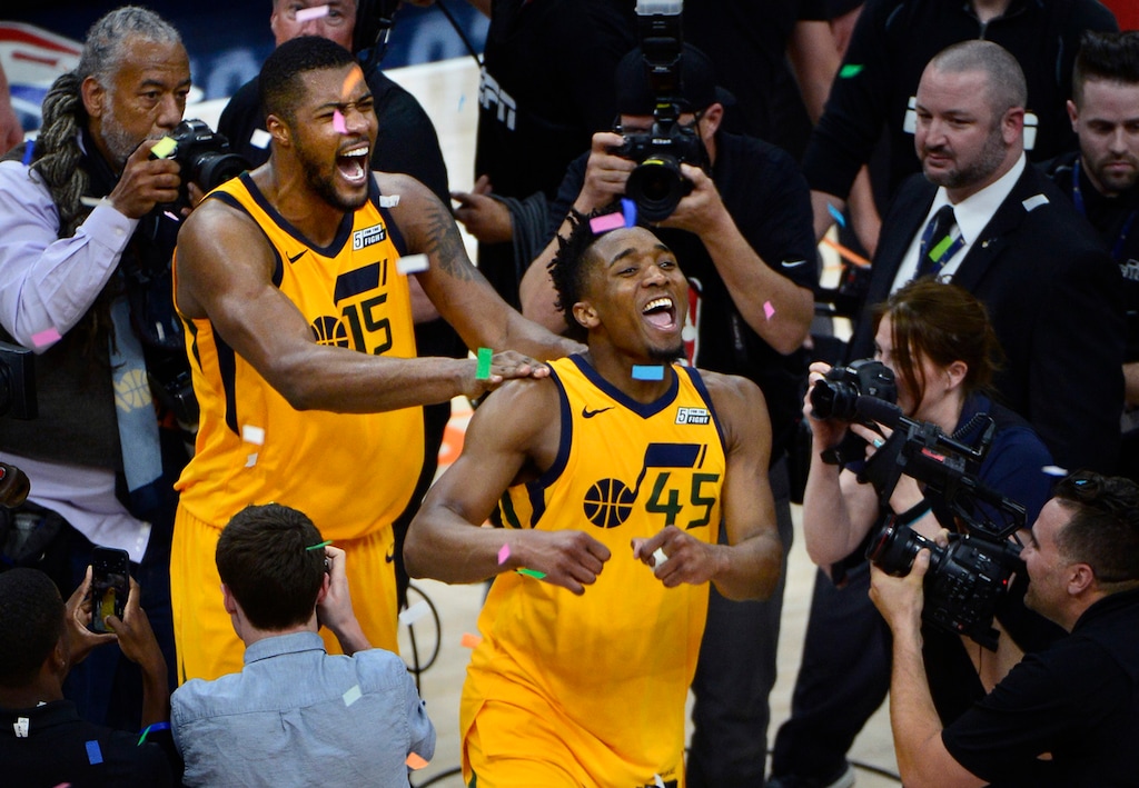 (Scott Sommerdorf | Tribune file photo) Utah Jazz guard Donovan Mitchell (45) and Utah Jazz forward Derrick Favors (15) celebrate the win over the Thunder. The Utah Jazz defeated the Oklahoma City Thunder 96-91 to win the first round playoff series, Friday, April 27, 2018.