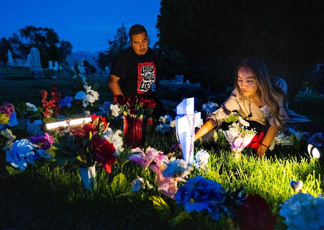 (Rick Egan | The Salt Lake Tribune) Freddie and Karina, the brother and sister of Bernardo Palacios-Carbajal, place flowers on Bernardo's grave site at the Salt Lake City Cemetery, on Wednesday, May 19, 2021.