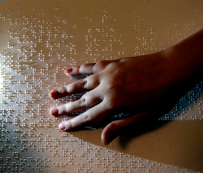 (Steve Griffin  |  The Salt Lake Tribune)  Ellie McKinlay works on her Braille literacy during the Utah Schools for the Deaf and Blind "Kids in the Classroom at the Capitol day" in Salt Lake City Thursday February 8, 2018. 