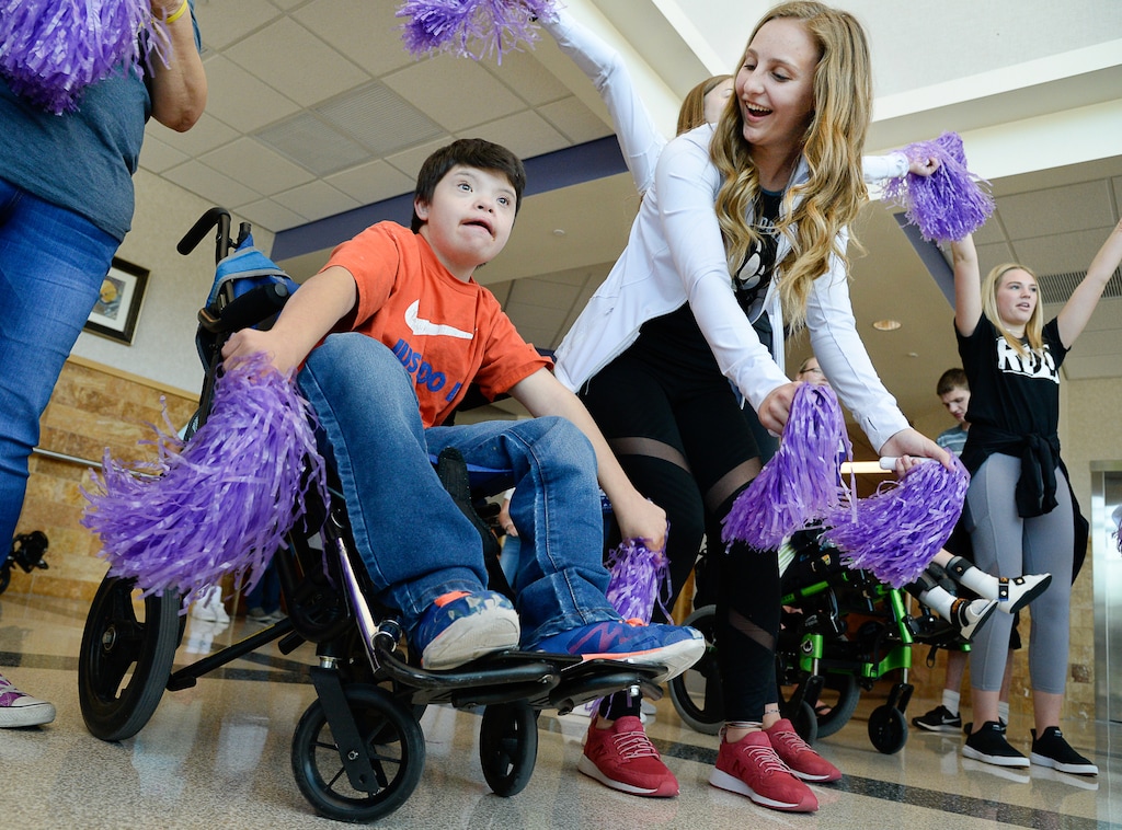 (Francisco Kjolseth  |  The Salt Lake Tribune)  Julian Lucero dances alongside Haylee Lamb as Riverton High cheer, drill and dance company members team up with special needs students from the Kauri Sue Hamilton School on Tuesday, Sept. 4, 2018, for their final rehearsal before an upcoming half-time performance on Friday when the Riverton High football team hosts Pleasant Grove.