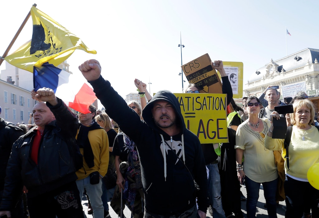 Yellow vest protesters march and shout slogans during a protest in Nice, southeastern France, Saturday, March 23, 2019. The French government vowed to strengthen security as yellow vest protesters stage a 19th round of demonstrations, following last week's riots in Paris. (AP Photo/Claude Paris)