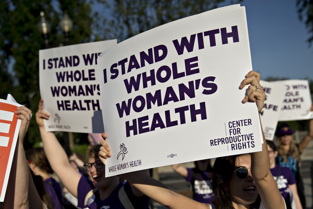 Pro-choice advocates hold signs outside the U.S. Supreme Court before rulings in Washington on June 27, 2016. (Andrew Harrer | Bloomberg)