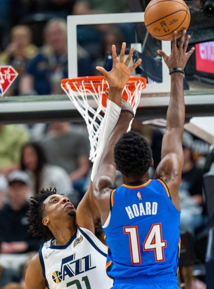 (Rick Egan | The Salt Lake Tribune)  Oklahoma City Thunder forward, Jaylen Hoard (14) shoots as Utah Jazz center Hassan Whiteside (21) defends, in NBA action between the Utah Jazz and the Oklahoma City Thunder at Vivint Arena, on Wednesday, April 6, 2022.
