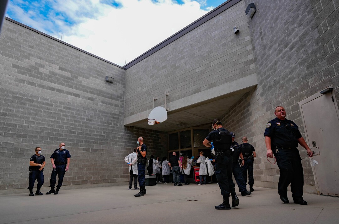 (Francisco Kjolseth | The Salt Lake Tribune) Nomi Health staff and prison guards remove PPE gear following a COVID-19 vaccination event for new inmates at the Utah State Prison in Draper on Tuesday, July 27, 2021.