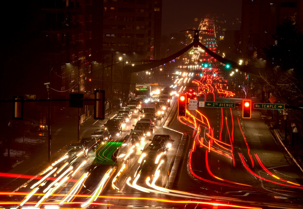 Leah Hogsten  |  The Salt Lake Tribune  In a long photographic exposure, car and bus taillights and headlights draw long red and white lights during evening traffic patterns along State Street, Jan. 10, 2019.