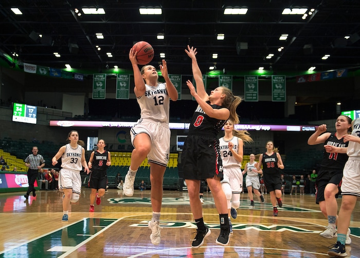 Scott Sommerdorf | The Salt Lake TribuneLauren Gustin drives for two of her 32 points during second half play. Salem Hills beat Hurricane 57-35 for the 4A girl's title, Saturday, March 3, 2018.