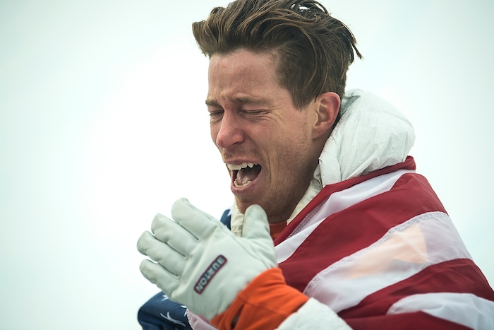 (Chris Detrick  |  The Salt Lake Tribune)  Shaun White reacts to seeing his friends and family after winning gold after his run during the men's halfpipe finals at Phoenix Snow Park during the Pyeongchang 2018 Winter Olympics Wednesday, Feb. 14, 2018.  White won the event with a 97.75, his third Olympic gold medal in the halfpipe (2006, 2010, 2018).