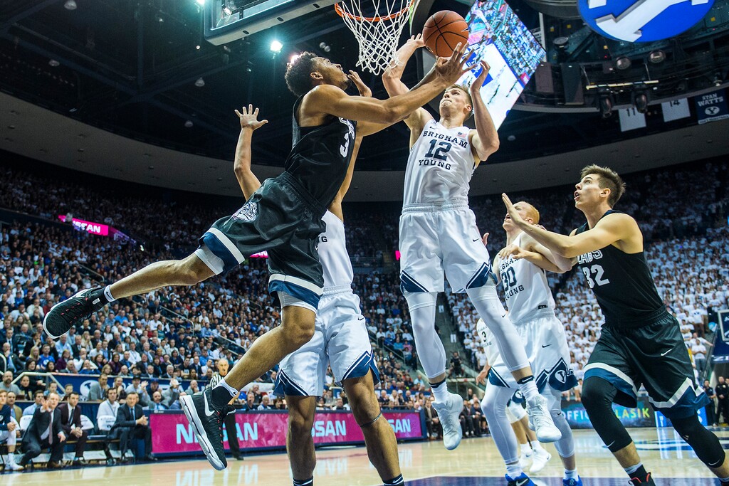 (Chris Detrick  |  The Salt Lake Tribune)  Gonzaga Bulldogs forward Johnathan Williams (3) shoots past Brigham Young Cougars forward Eric Mika (12) during the game at the Marriott Center Thursday February 2, 2017.