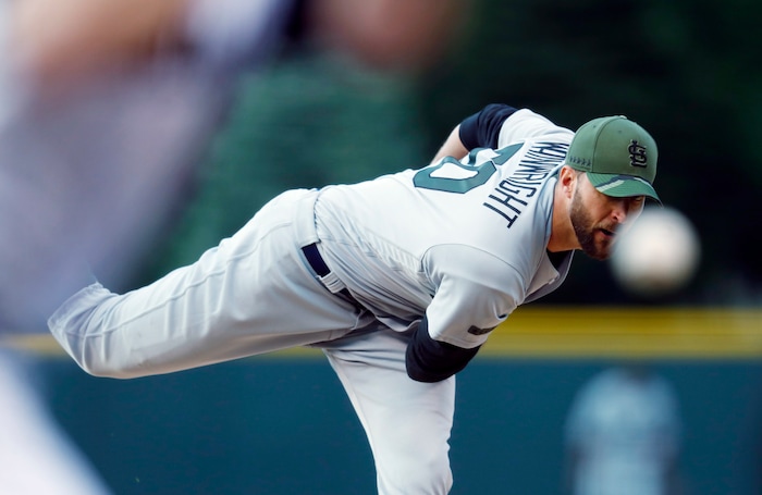 St. Louis Cardinals starting pitcher Adam Wainwright delivers to Colorado Rockies' DJ LeMahieu in the first inning of a baseball game Saturday, May 27, 2017, in Denver. (AP Photo/David Zalubowski)