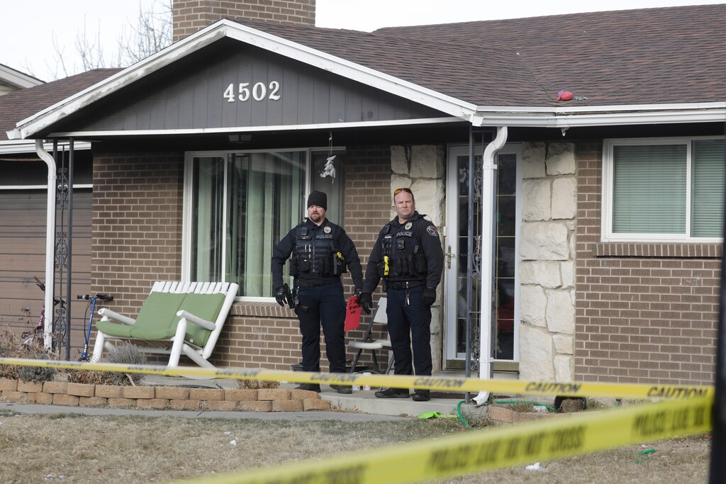 (Rick Bowmer | AP) West Valley City policemen stands in front of a home Tuesday, Dec. 31, 2019, in West Valley City, Utah. A Utah mother is suspected of killing her 4-year-old daughter, The woman knocked on her neighbor's door in a Salt Lake City suburb early Tuesday morning and told them she had killed her daughter, West Valley City police said in a news release. Officers went to the house and found the woman waiting on the porch and the dead child in the basement of her home.