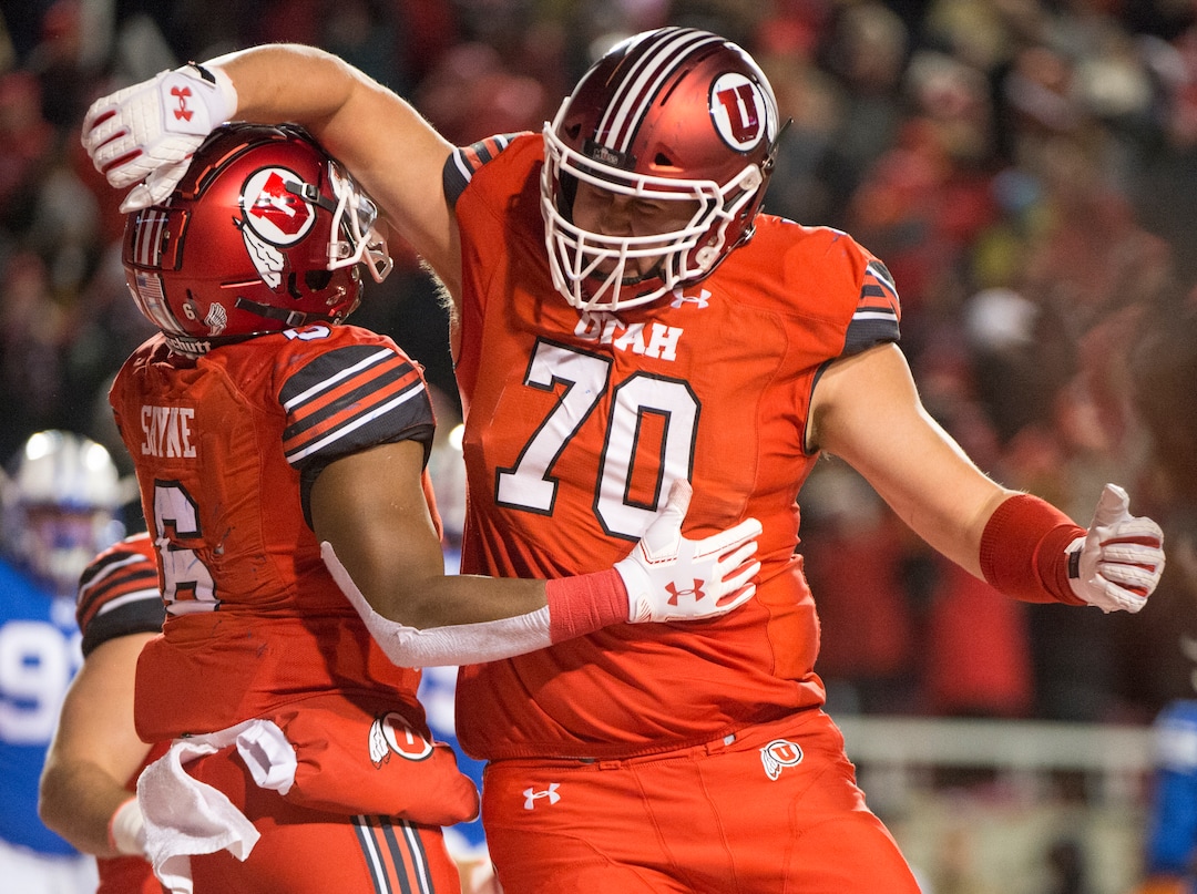 (Rick Egan  |  The Salt Lake Tribune)        Utah Utes running back Armand Shyne (6) celebrates with Utah Utes offensive lineman Jackson Barton (70), after scoring a touchdown late in the 4th quarter, tying the score at 27-27, in football action between the Brigham Young Cougars and the Utah Utes, at Rice-Eccles Stadium, Saturday, November 24, 2018.