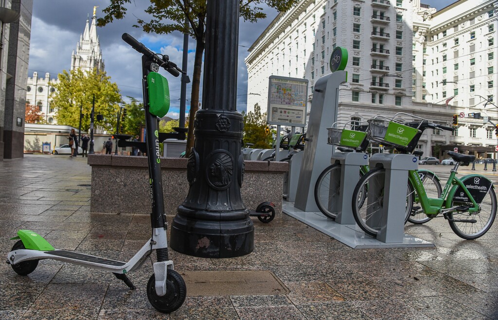 (Francisco Kjolseth  |  The Salt Lake Tribune)  GreenBike was on track to have their best year yet but then Lime and Bird scooters derailed their momentum as both modes of transportation are seen in downtown Salt Lake City on Tuesday, Oct. 2, 2018.