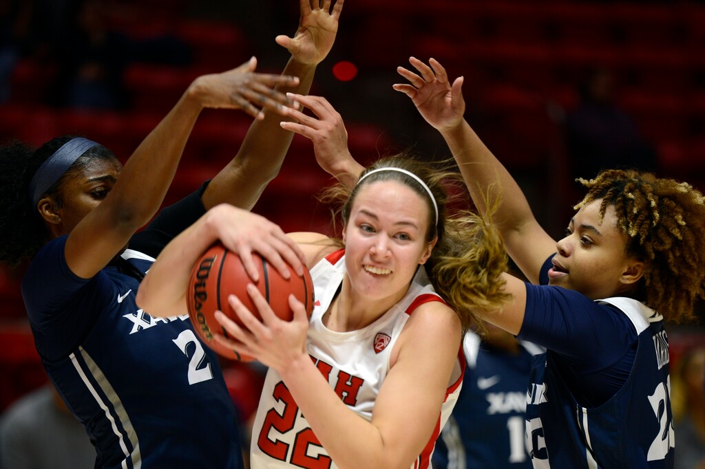 Utah Utes forward Jenna Johnson (22) dribbles through the defense during an NCAA basketball game on Saturday, Nov. 13, 2021 in Salt Lake City, Utah. (AP Photo/Tyler Tate)