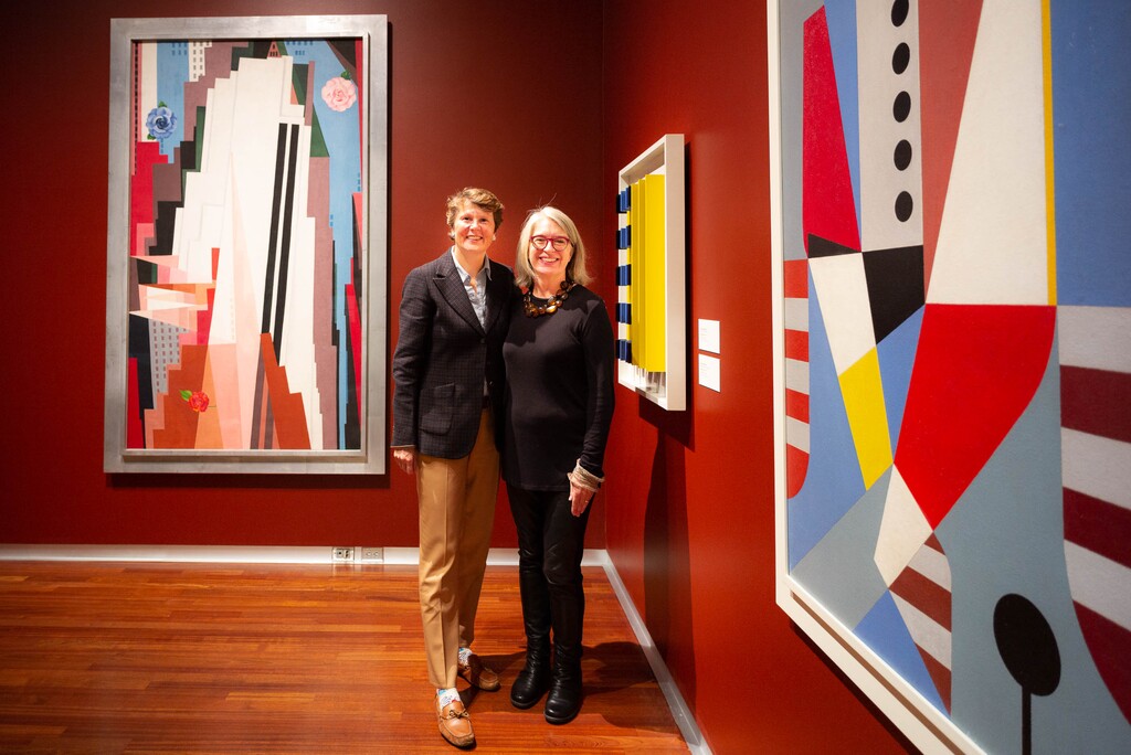(Trent Nelson | The Salt Lake Tribune) Stephanie Stebich, director of the Smithsonian American Art Museum, and Gretchen Dietrich, executive director of the Utah Museum of Fine Arts, stand with, at left, Georgia O'Keeffe's "Manhattan" (1932). The piece is one of three iconic landscape paintings on loan from the Smithsonian American Art Museum at the Utah Museum of Fine Arts in Salt Lake City on Friday Oct. 25, 2019. At right is Charles G. Shaw's "Top Flight #1 (1944)".