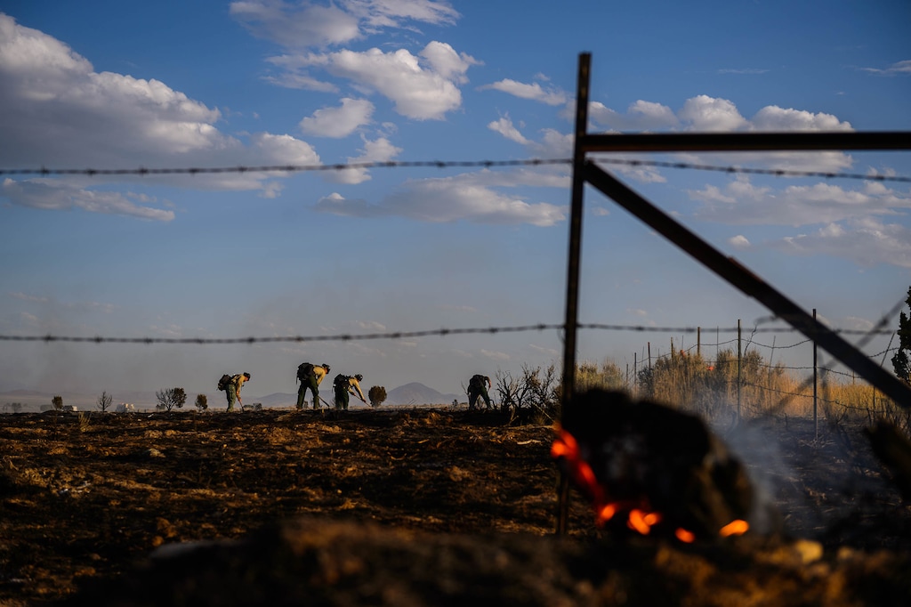 (Trent Nelson  |  The Salt Lake Tribune) Crews search for hot spots after a fire in Cedar Fort on Wednesday, Aug. 12, 2020.